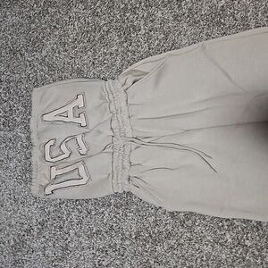 Never worn brand new jumpsuit size 4 in the color stone